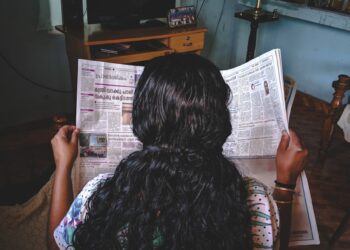 woman reading newspaper