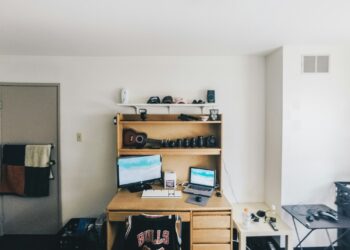 brown wooden desk with computer set