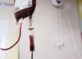 a blood test tube with a blood dropper attached to it